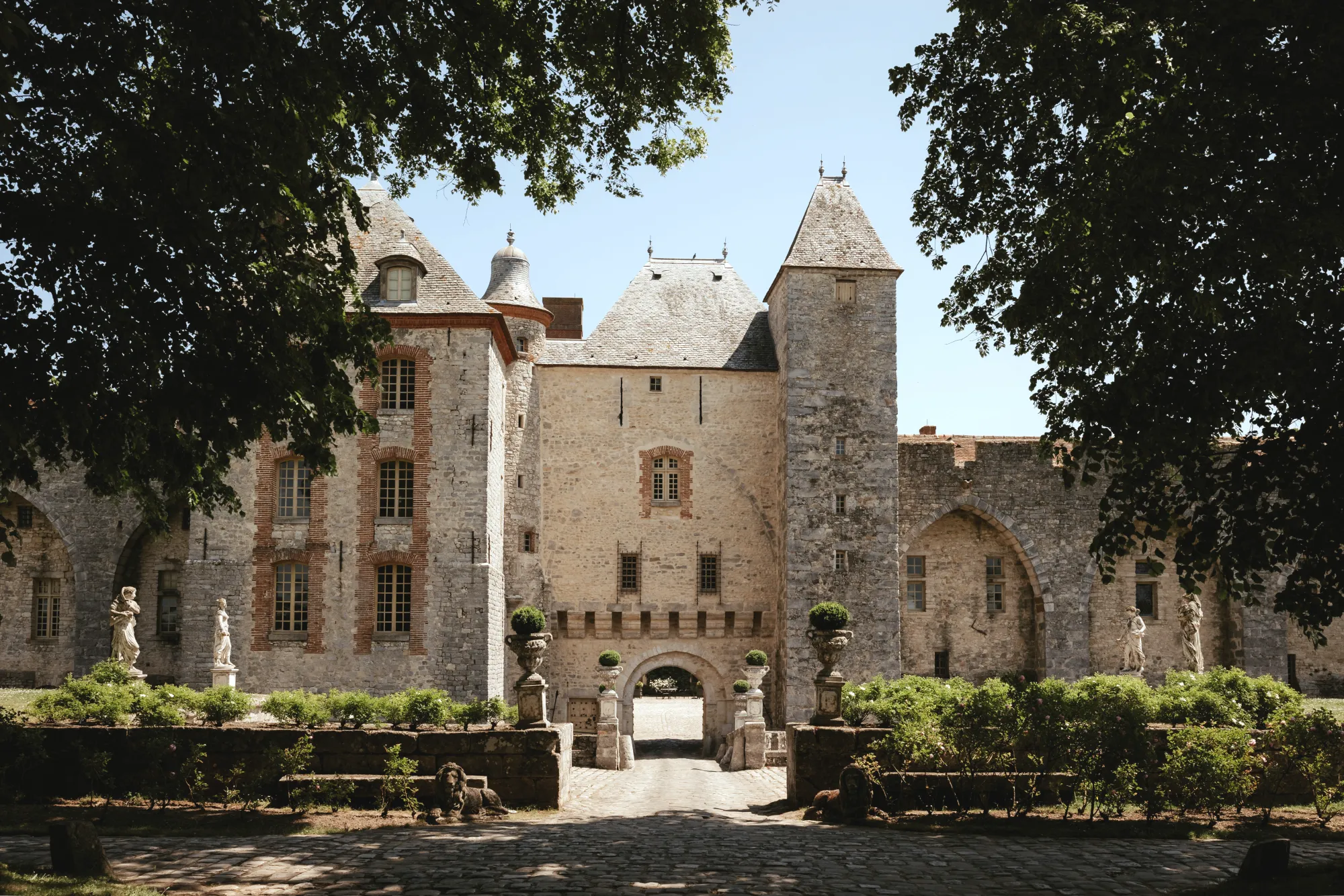 The château from the courtyard garden, statues in the foreground