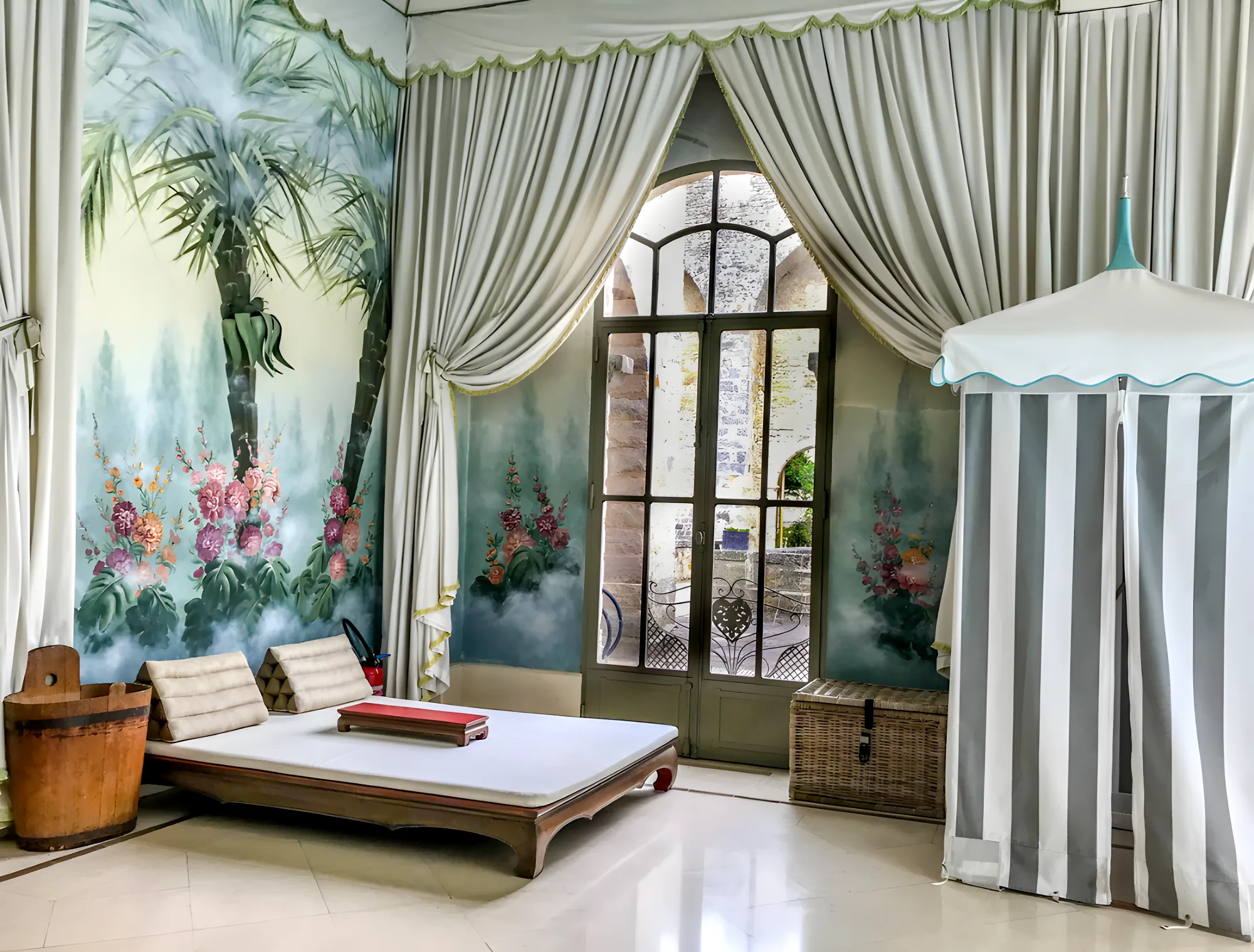 The spa's relaxation room, striped cabana and palm fresco