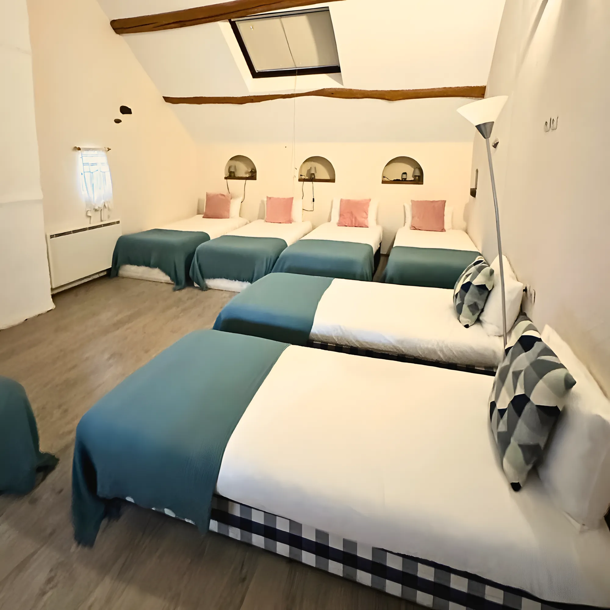The dormitory, single beds under the skylight