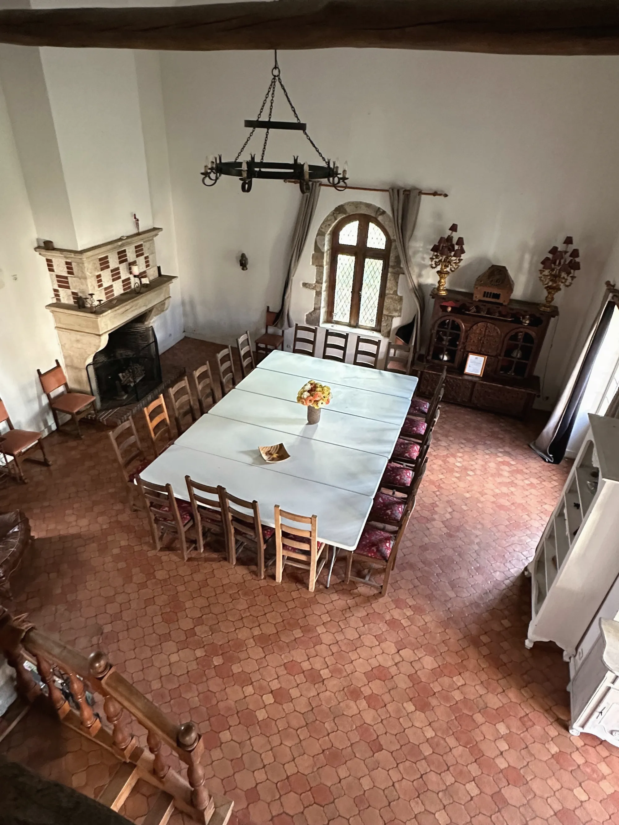 The Grand Séjour Cathédrale from the mezzanine, the long white table before the fireplace